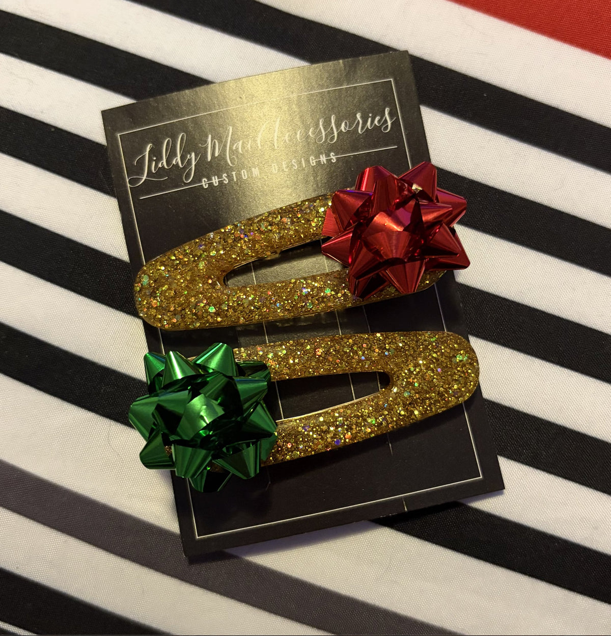 Gold glitter gift-bow resin hair clips by Liddy Mai Accessories